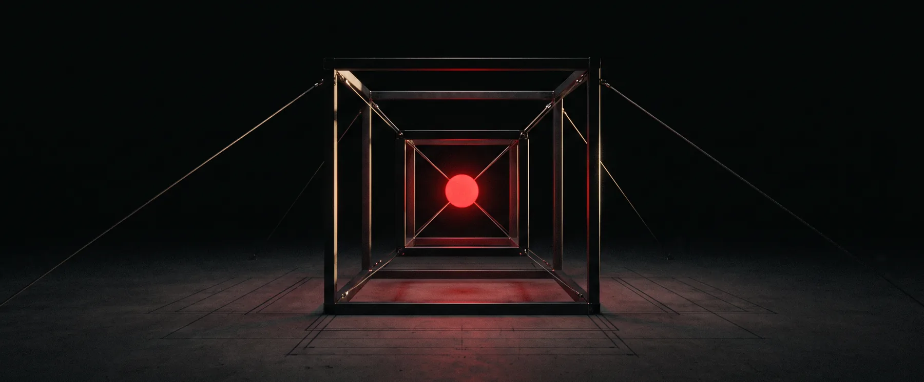 Illustration: a small glowing red core held at the centre of an open black steel cube, tied down by taut cables over a dark blueprint-grid floor.