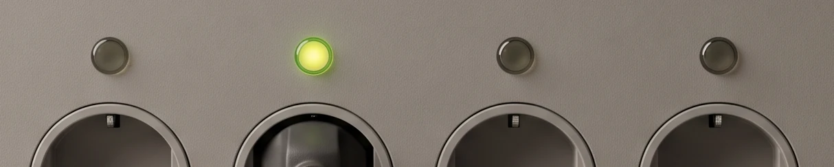 A row of four indicator lamps above four round sockets on a warm grey panel; the second lamp glows green above a seated plug, the other three are dark.